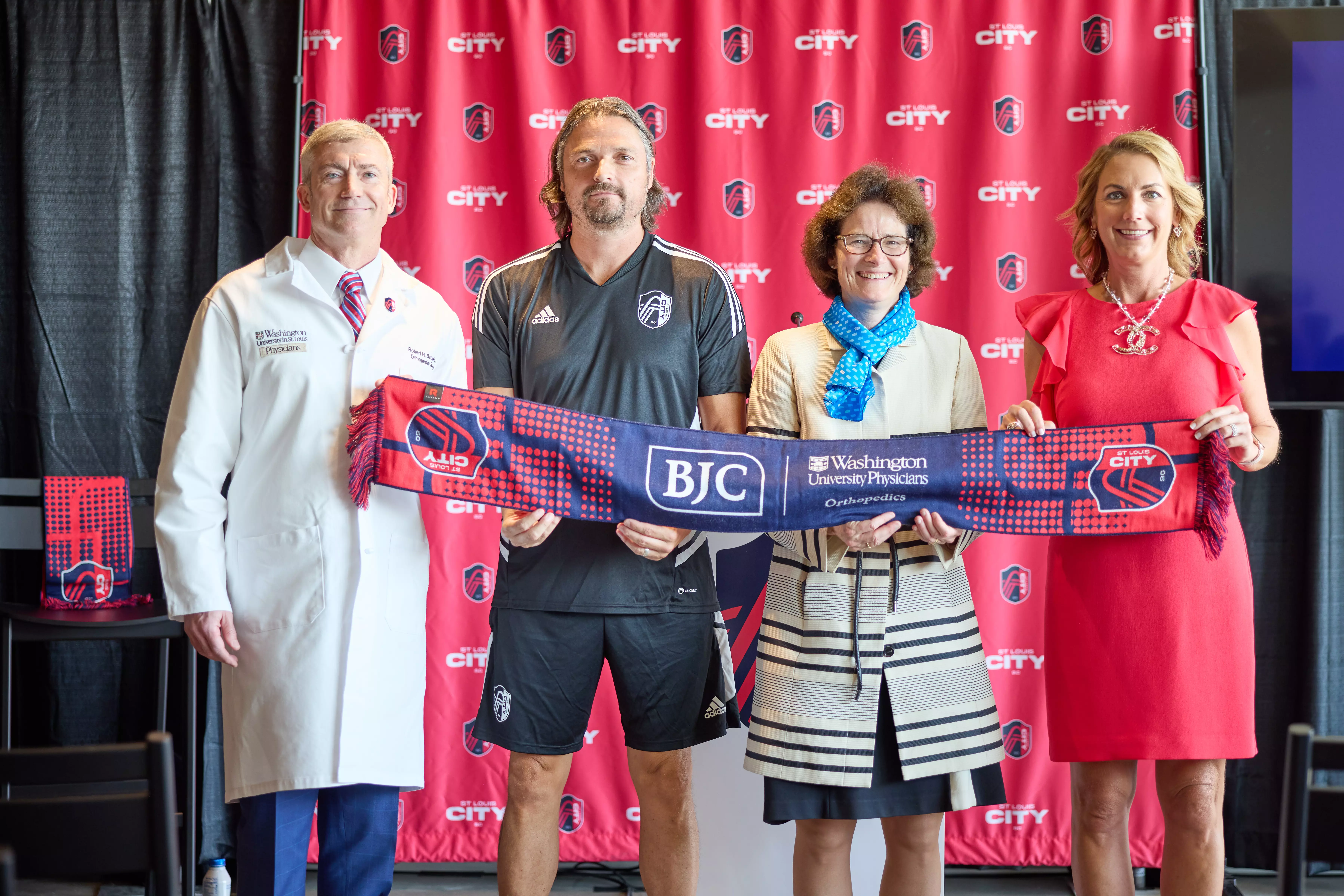  Pictured at the event are (from left) Robert Brophy, MD, the team’s medical director and head orthopedic surgeon, who is also chief of sports medicine and a professor of orthopedic surgery at Washington University School of Medicine; St. Louis CITY SC Sporting Director Lutz Pfannenstiel; Joan Magruder, group president for BJC HealthCare; and St. Louis CITY SC CEO Carolyn Kindle. (Photo: Matt Miller/School of Medicine)