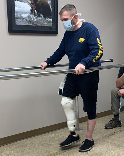 Patrick learning to walk after leg amputation surgery