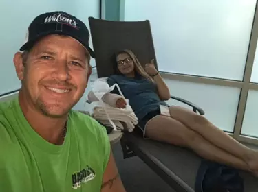 Kaitlyn and her dad after surgery