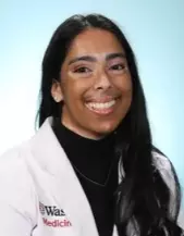 Portrait of Madi Hoppe, physician assistant in lab coat.